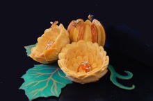 Pumpkins carved into flowers with bees